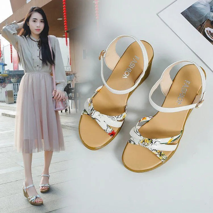 Women's pink wedge sandals with waterproof platform and buckle closure on white background