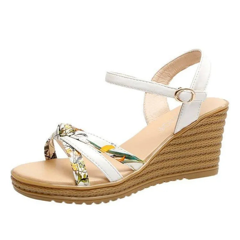 Women's pink wedge sandals with waterproof platform and buckle closure on white background