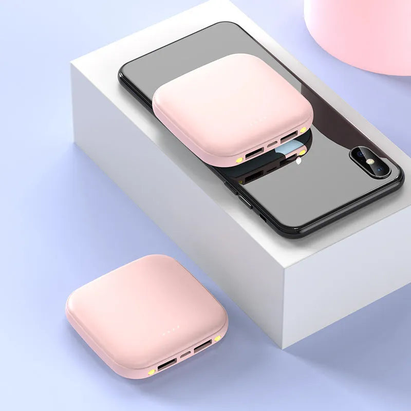 Compact black power bank with 20000mAh capacity and a small LED flashlight on the side.
