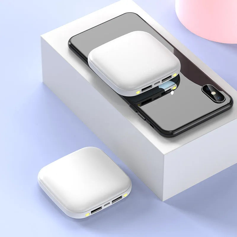 Compact black power bank with 20000mAh capacity and a small LED flashlight on the side.