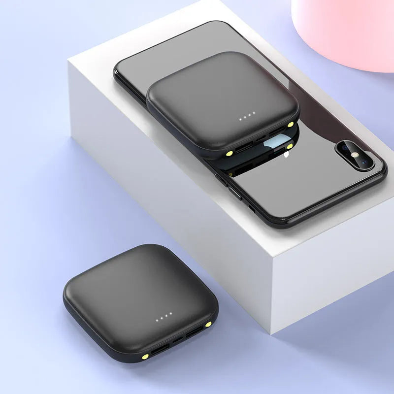 Compact black power bank with 20000mAh capacity and a small LED flashlight on the side.