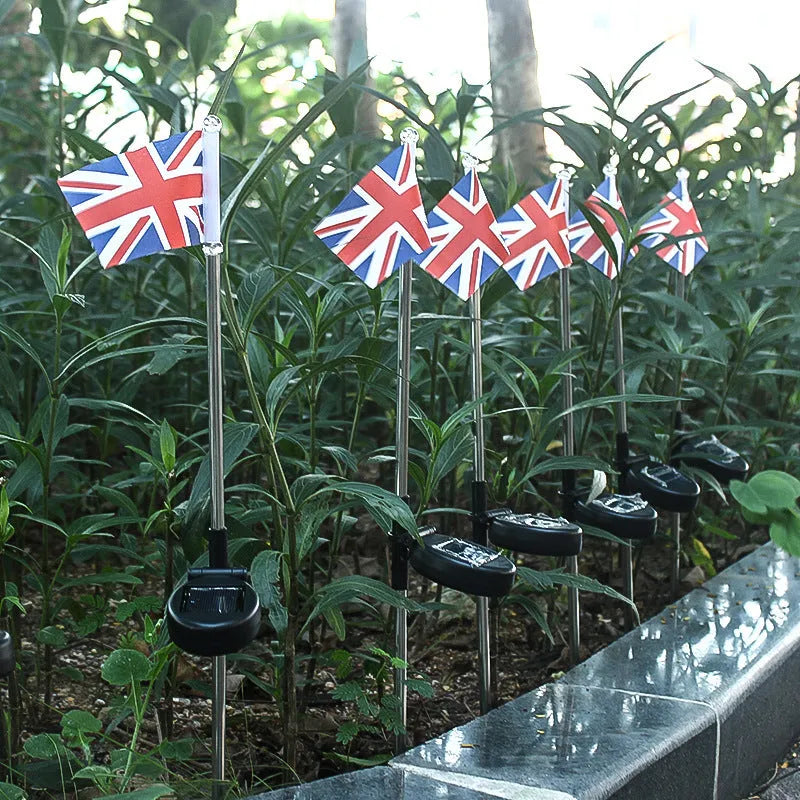 Solar-powered garden flag light with stainless steel pole displaying American or British flag design