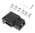 Black aluminium woodworking perforation locator tool with angled sleeves for dowel hole alignment