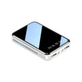 Compact digital display power bank showing battery percentage with dual USB ports in multiple colour options