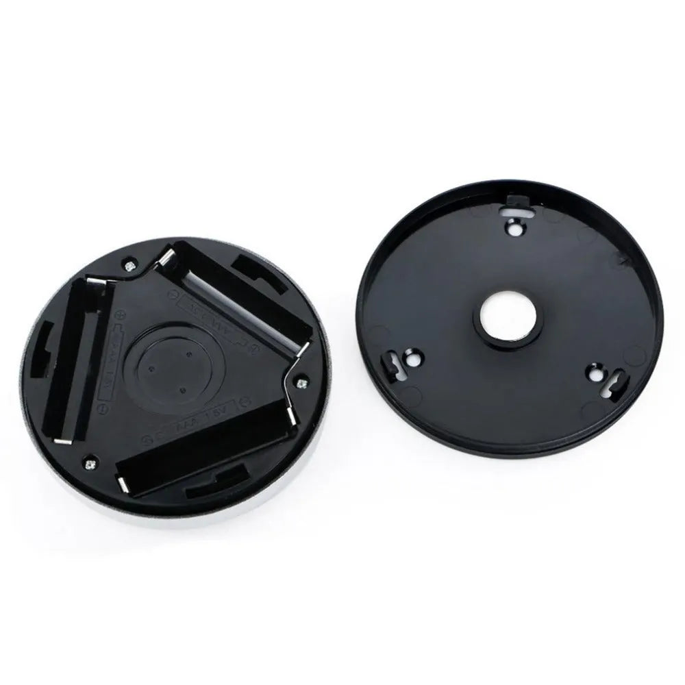 Silver square wireless motion sensor night light on a surface, showing its compact 80mm x 80mm size.