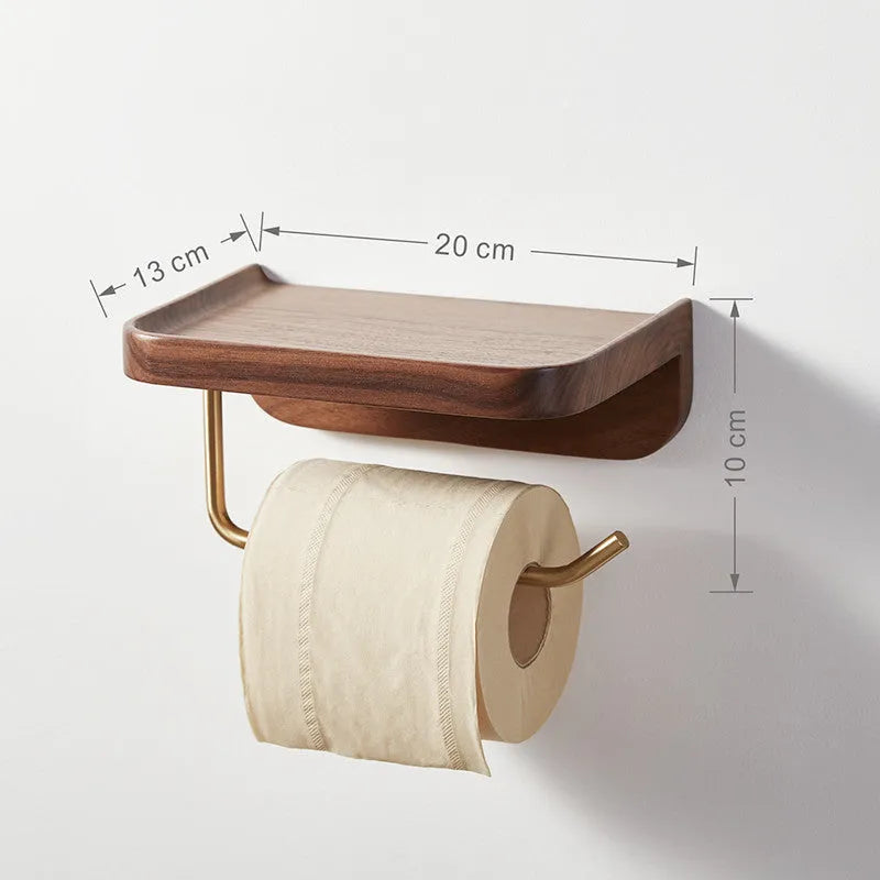 Solid walnut wood and brass wall-mounted paper towel and toilet roll holder on a wall.