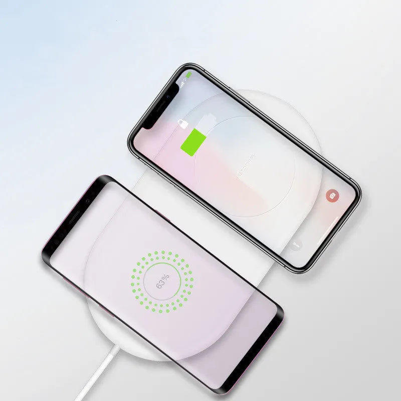 A simple white dual wireless charging pad for two mobile phones.