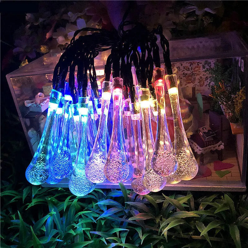 Solar-powered LED garden string lights with water drop shaped ABS pendants on a 6.5 metre wire.
