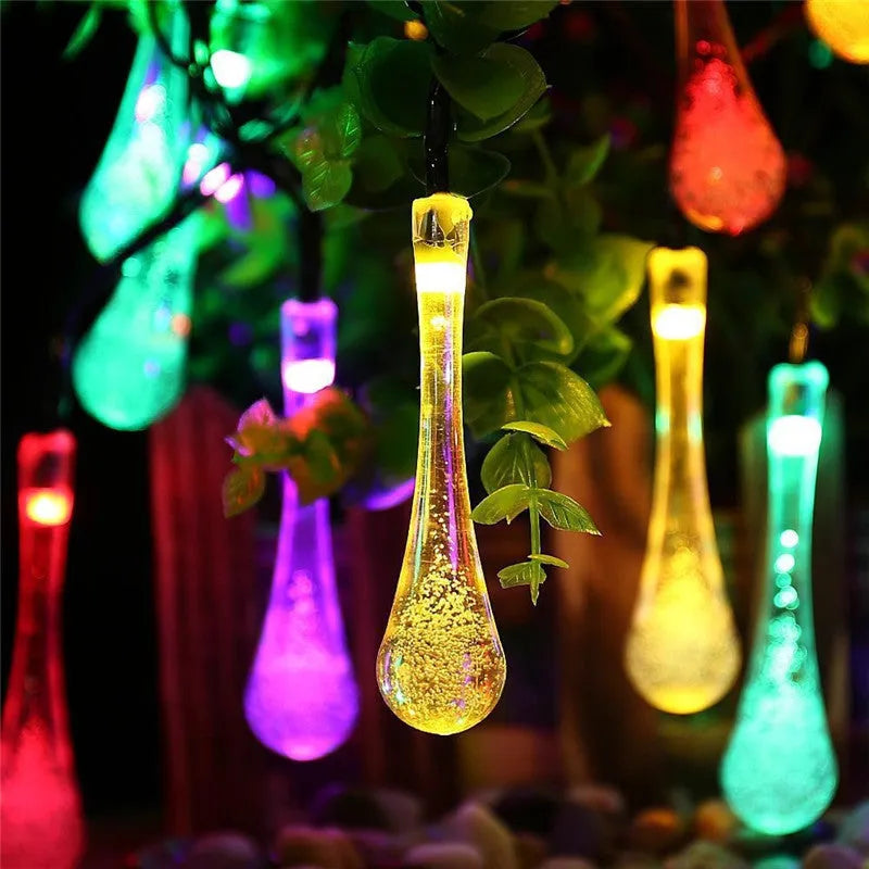 Solar-powered LED garden string lights with water drop shaped ABS pendants on a 6.5 metre wire.