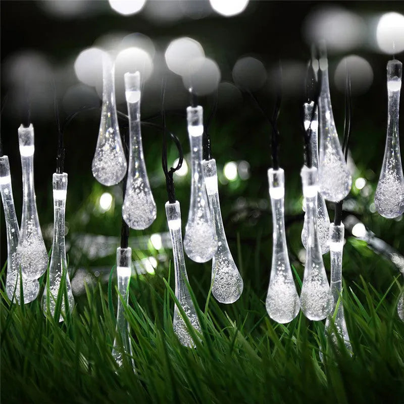 Solar-powered LED garden string lights with water drop shaped ABS pendants on a 6.5 metre wire.