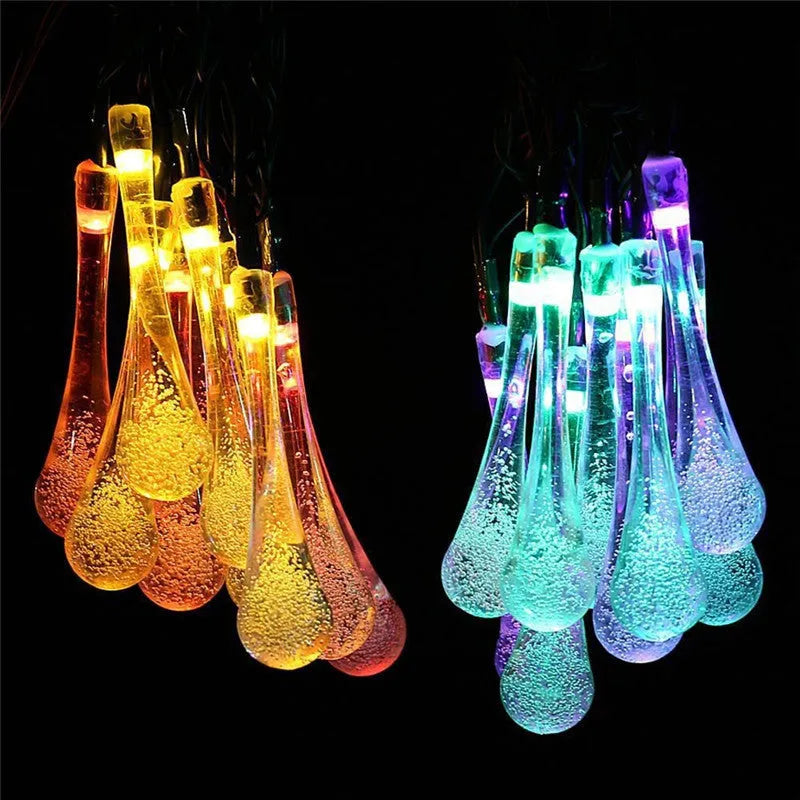 Solar-powered LED garden string lights with water drop shaped ABS pendants on a 6.5 metre wire.