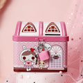 Blue house shaped tinplate piggy bank for coin storage on desktop