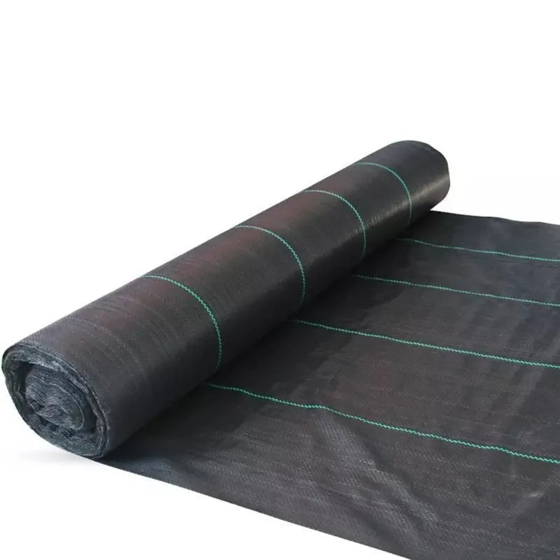 Black polyethylene woven weed proof cloth laid flat on soil, showing its texture and one of the available size options.