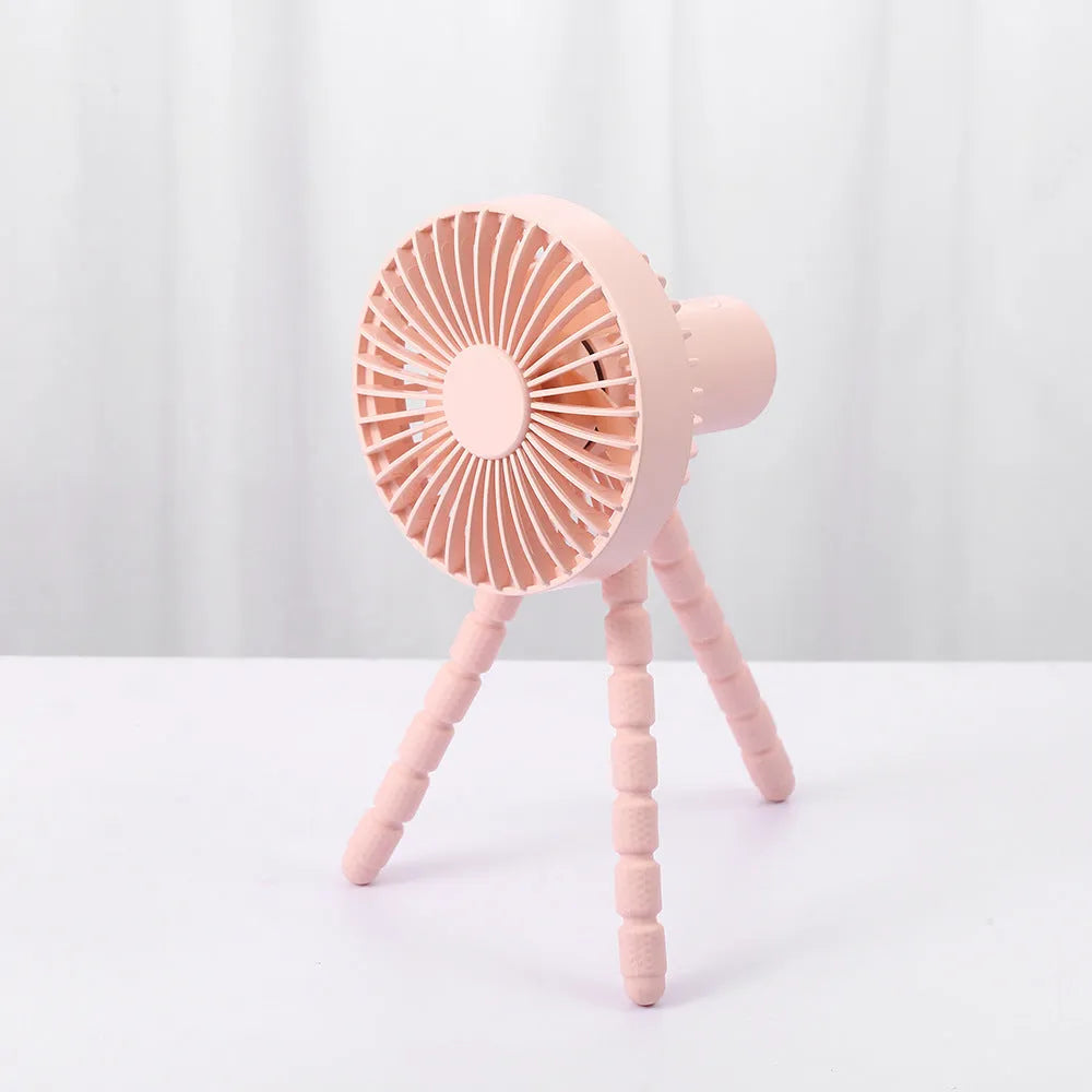 Small rechargeable desktop fan with adjustable tripod and multi-function handle, in black, green, pink, or white.