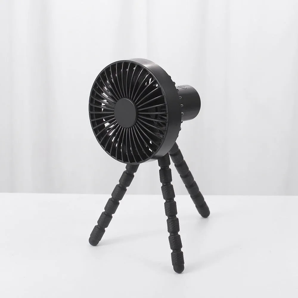 Small rechargeable desktop fan with adjustable tripod and multi-function handle, in black, green, pink, or white.