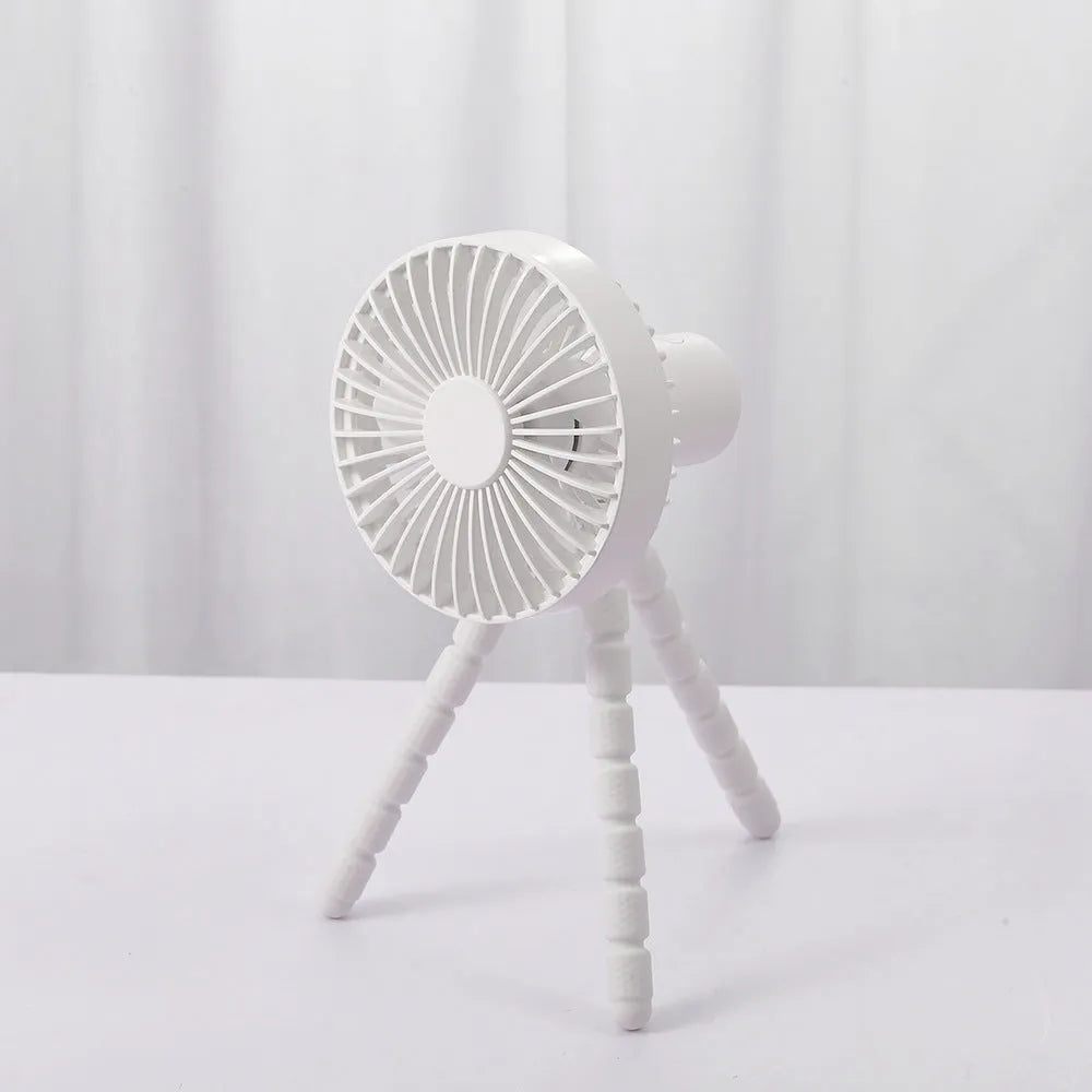 Small rechargeable desktop fan with adjustable tripod and multi-function handle, in black, green, pink, or white.