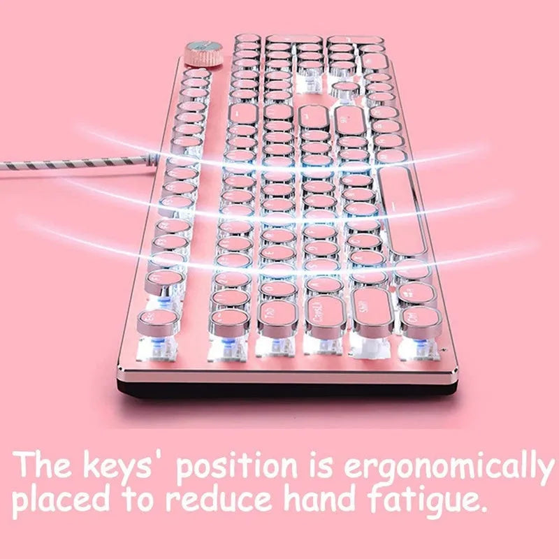 Silver and pink wired mechanical keyboard with green axis switches and a wireless mouse on a desk.