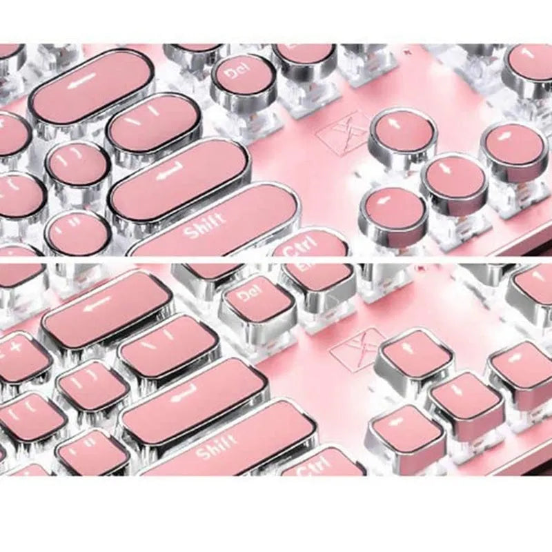 Silver and pink wired mechanical keyboard with green axis switches and a wireless mouse on a desk.