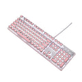 Silver and pink wired mechanical keyboard with green axis switches and a wireless mouse on a desk.
