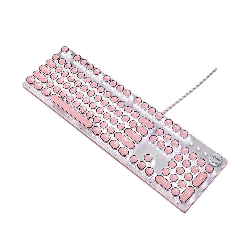 Silver and pink wired mechanical keyboard with green axis switches and a wireless mouse on a desk.