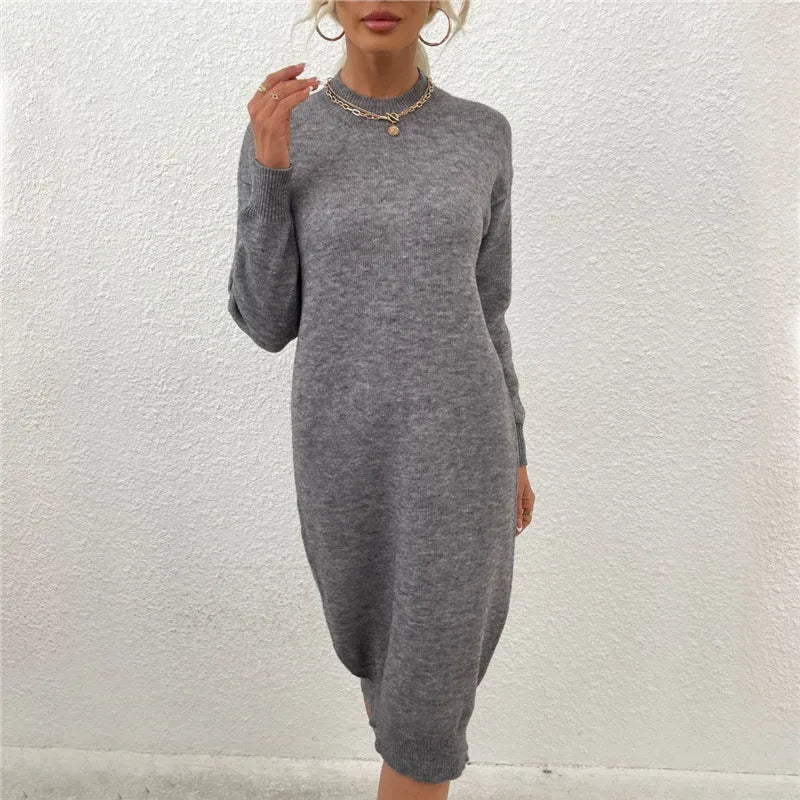 Gray women's acrylic crew neck pullover sweater on a hanger.