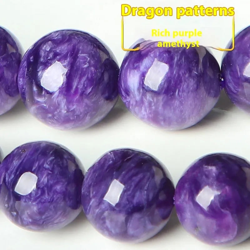 Natural transparent charoite crystal bracelet with platinum fastening on a wrist.