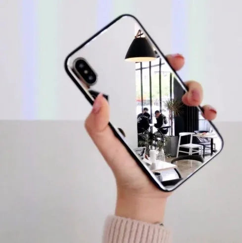 Black iPhone case with a reflective mirror surface on the back, compatible with iPhone X and iPhone 7/8 Plus models.