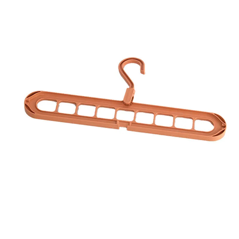 Plastic nine-hole folding trouser hanger in beige, blue, grey, green, or pink colour