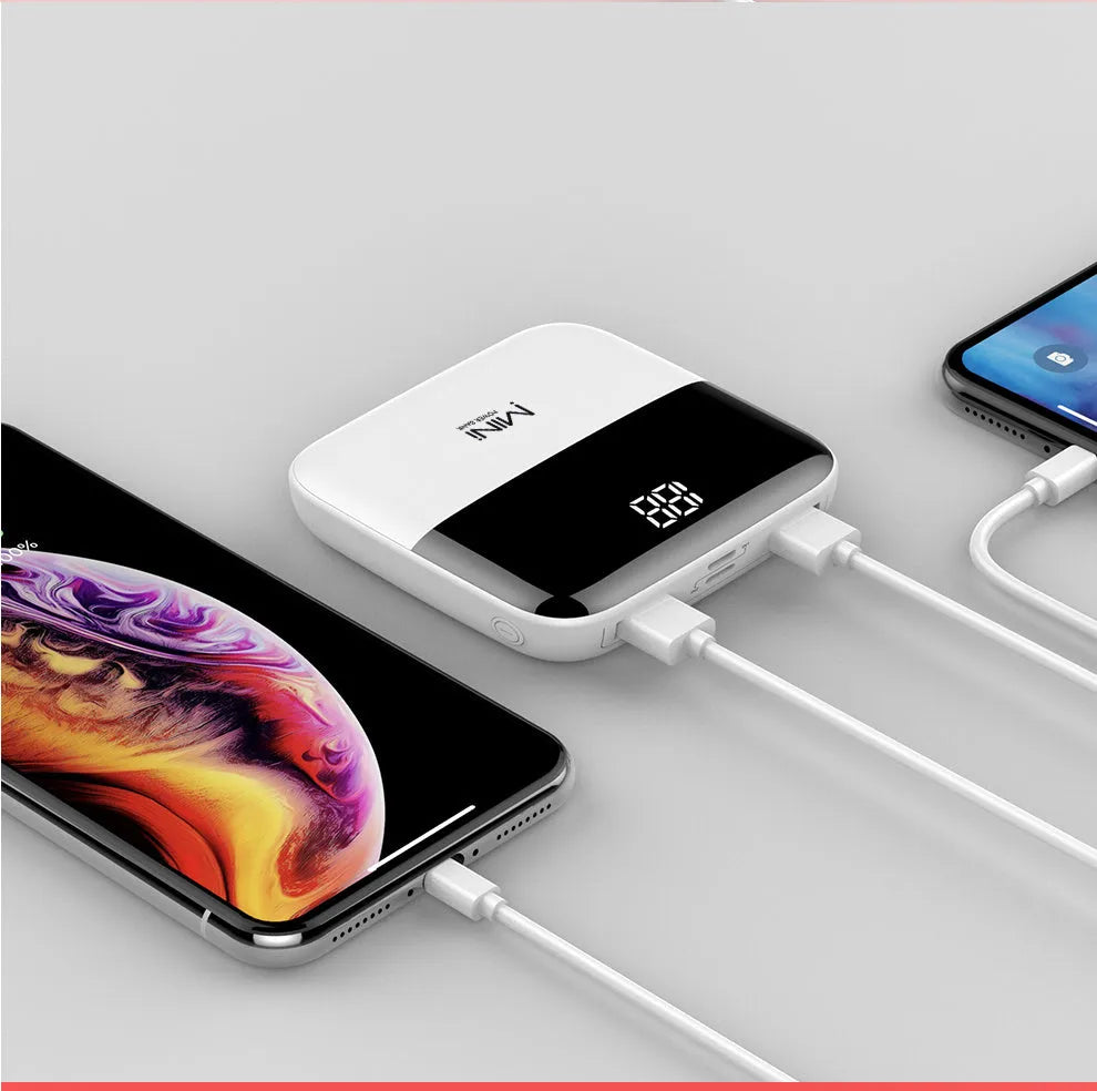 White 10000mAh portable power bank with digital display showing battery percentage and two USB ports.