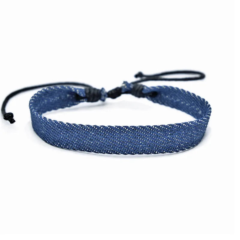 Denim fabric bracelet carrying strap with mixed materials and unisex design