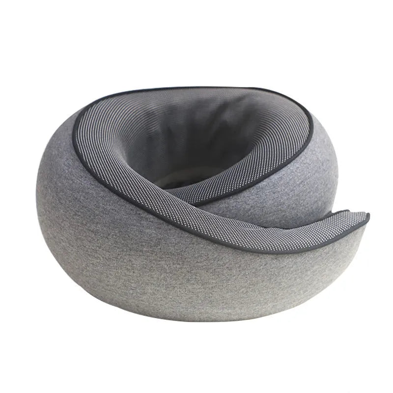 A grey U-shaped memory foam travel neck pillow with a storage bag, shown on a plain background.