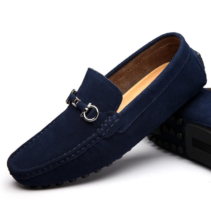 Men's black slip-on cowhide leather shoes with square toe and visible stitching on a rubber sole.