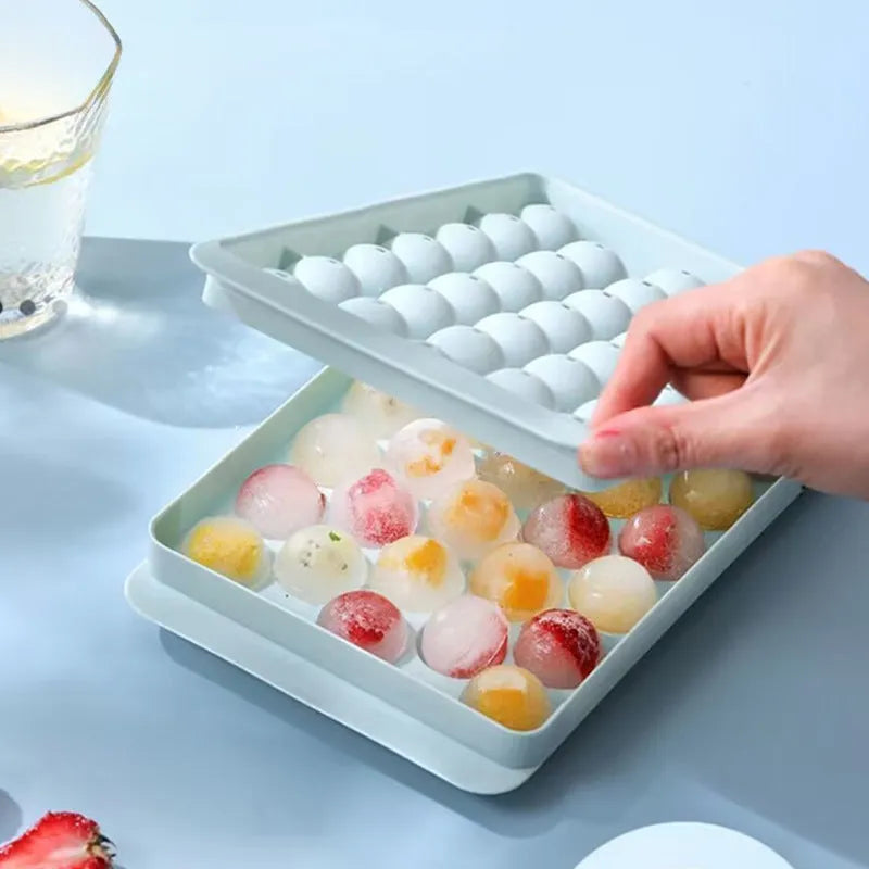 Blue PE ice cube tray with lid showing 33 round moulds.