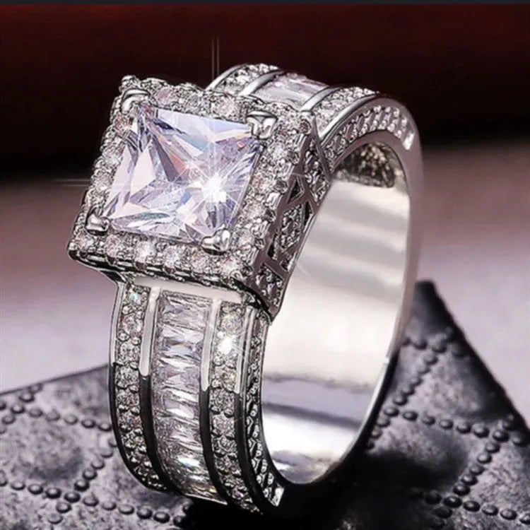 Silver-toned geometric women's ring with round elements in gold or white electroplated finish