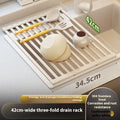 Milky white tri-fold stainless steel kitchen draining rack shown extended for use and folded for storage
