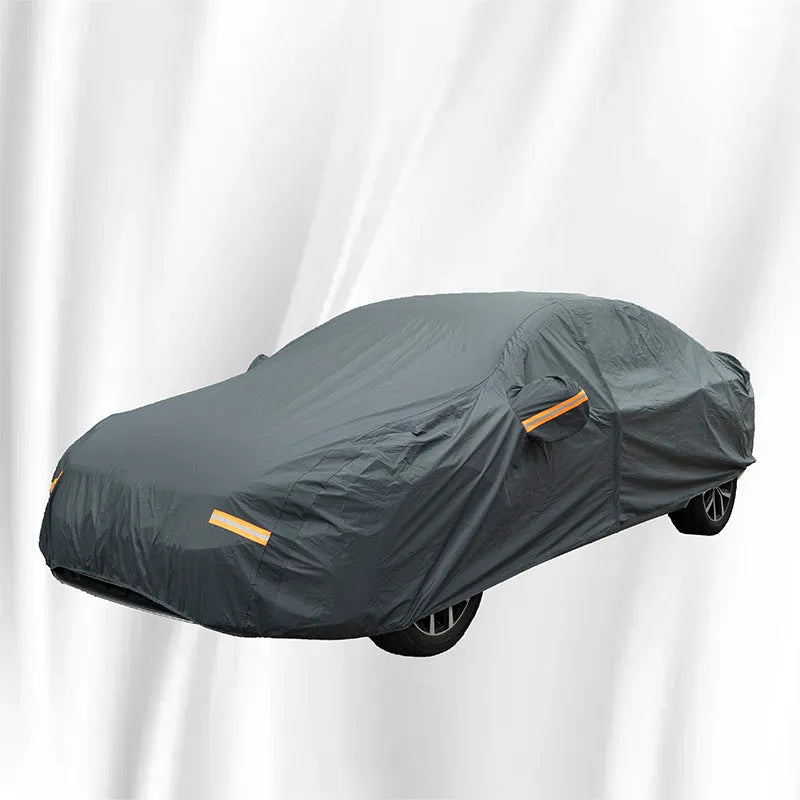 Grey PVC car cover for a Volkswagen vehicle showing rainproof and sun protection features.