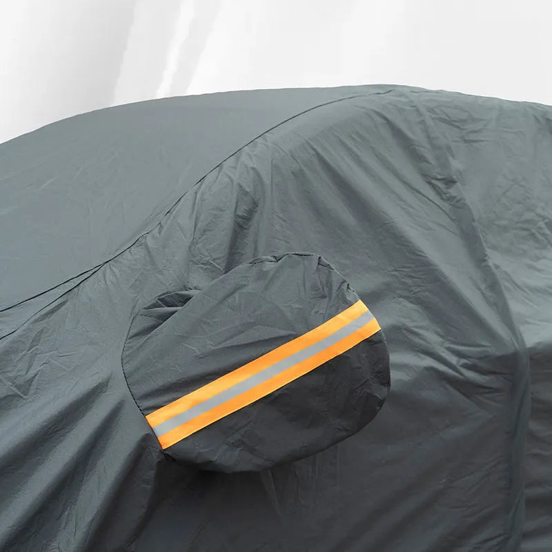 Grey PVC car cover for a Volkswagen vehicle showing rainproof and sun protection features.
