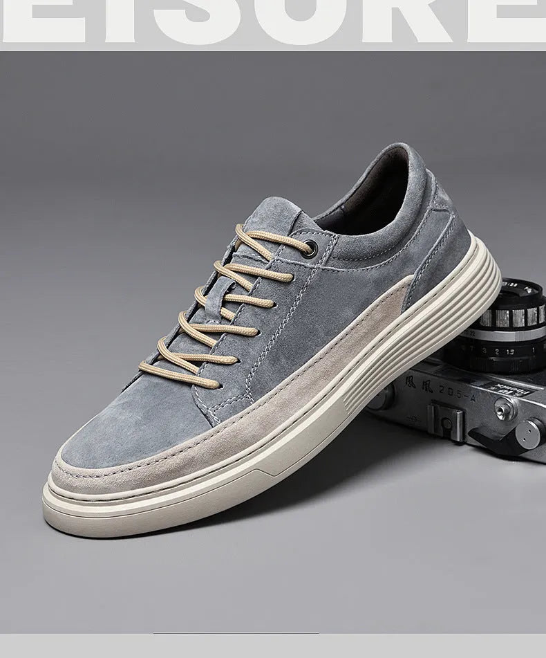 Men's grey casual skate shoes made of pigskin leather with a rubber sole and front lace-up.