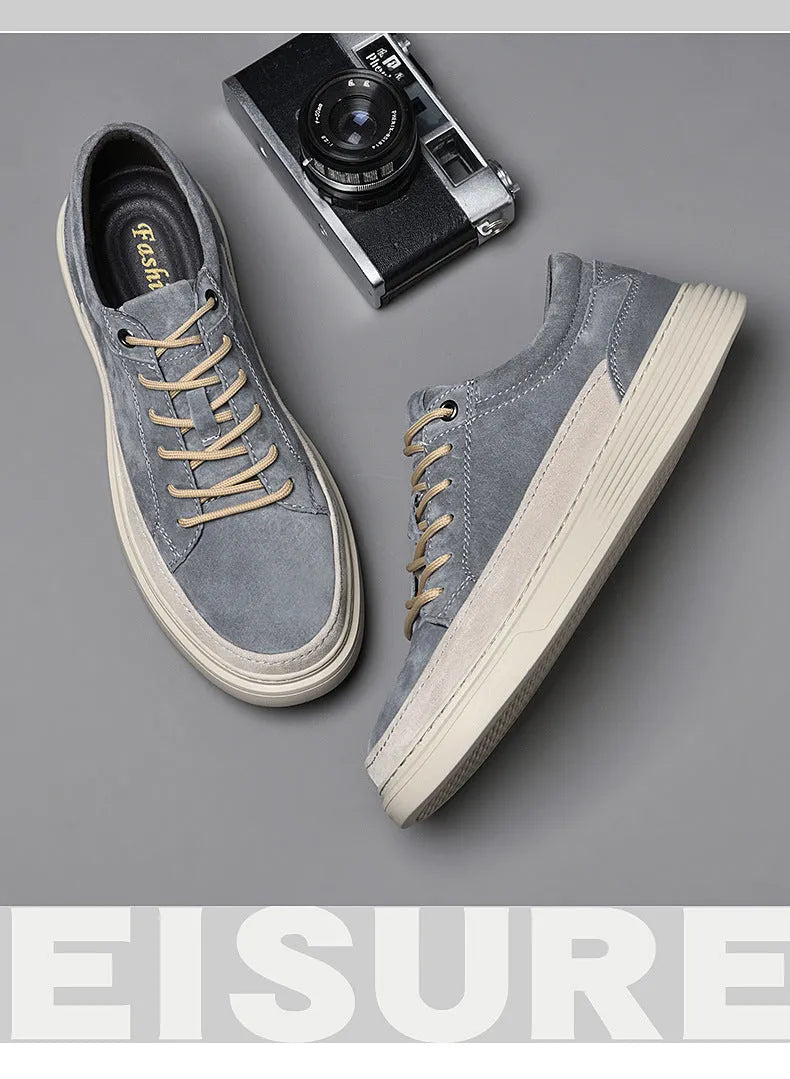 Men's grey casual skate shoes made of pigskin leather with a rubber sole and front lace-up.