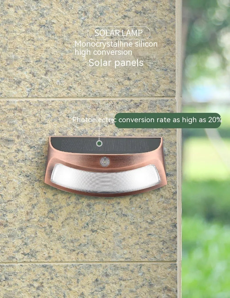 Solar outdoor wall lamp with smiling face design measuring 153mm by 76mm by 38mm