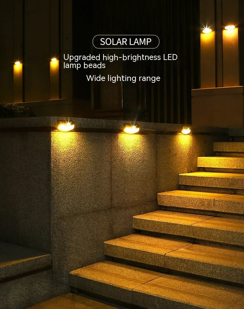 Solar outdoor wall lamp with smiling face design measuring 153mm by 76mm by 38mm