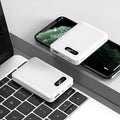Black and white portable power bank showing USB ports and dimensions 92x63x23mm