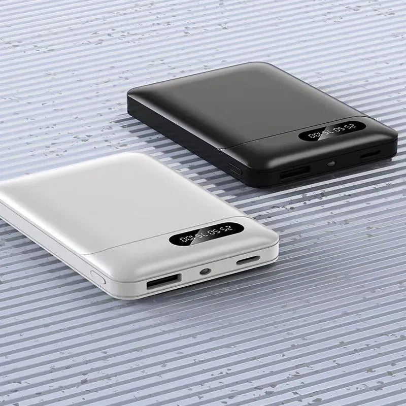 Black and white portable power bank showing USB ports and dimensions 92x63x23mm