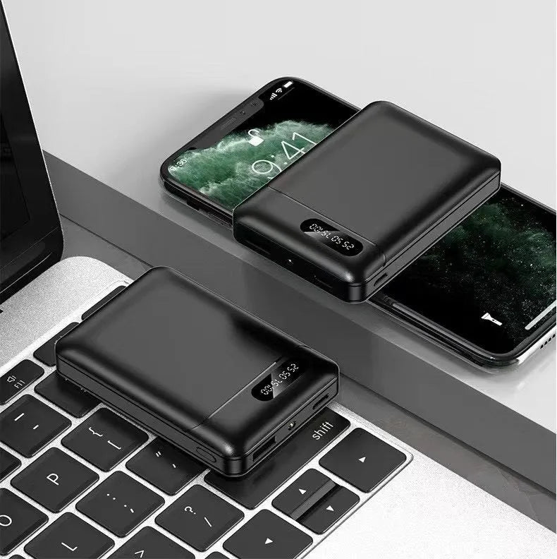 Black and white portable power bank showing USB ports and dimensions 92x63x23mm