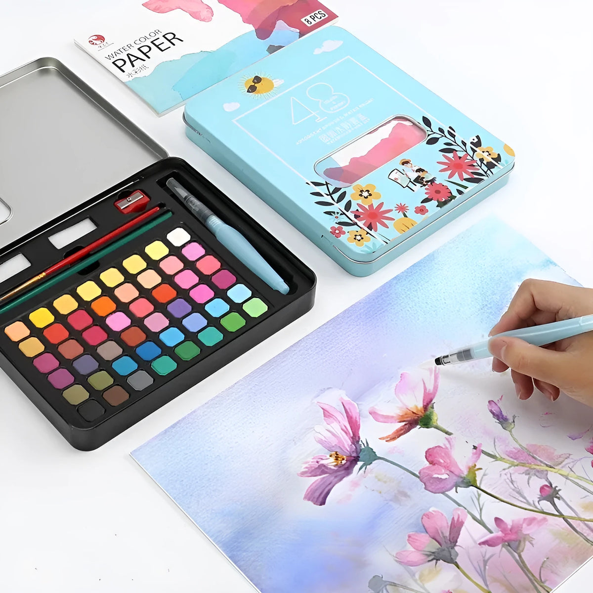 48 colour solid watercolour paint set in box showing Black Knight, Girl Pink and Sunshine Blue pans