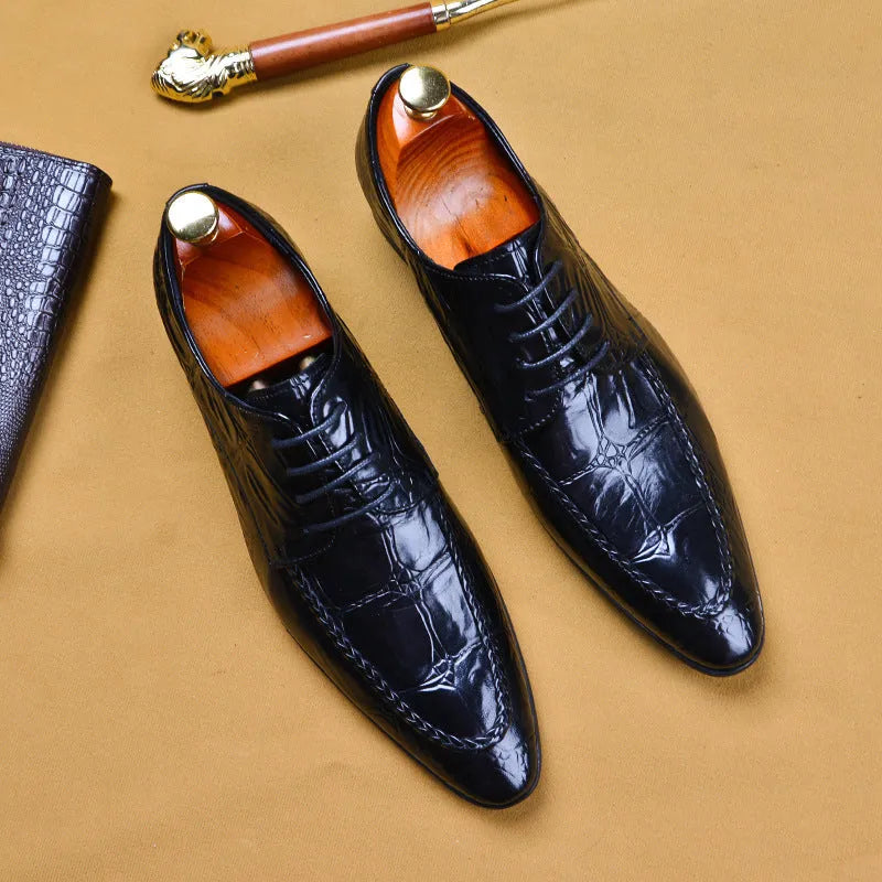 Men's black low-top leather shoes with alligator pattern texture and a silver horse bit buckle.