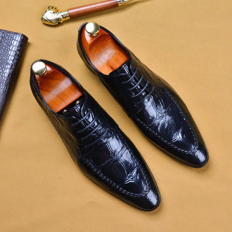 Men's black low-top leather shoes with alligator pattern texture and a silver horse bit buckle.