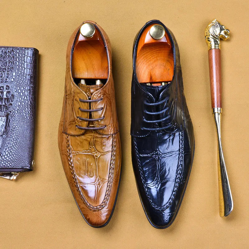 Men's black low-top leather shoes with alligator pattern texture and a silver horse bit buckle.