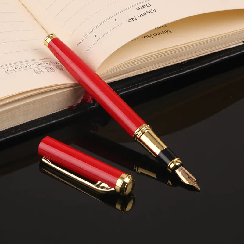 Red and black metal fountain pen with a 0.5mm Yijin nib on a writing surface.