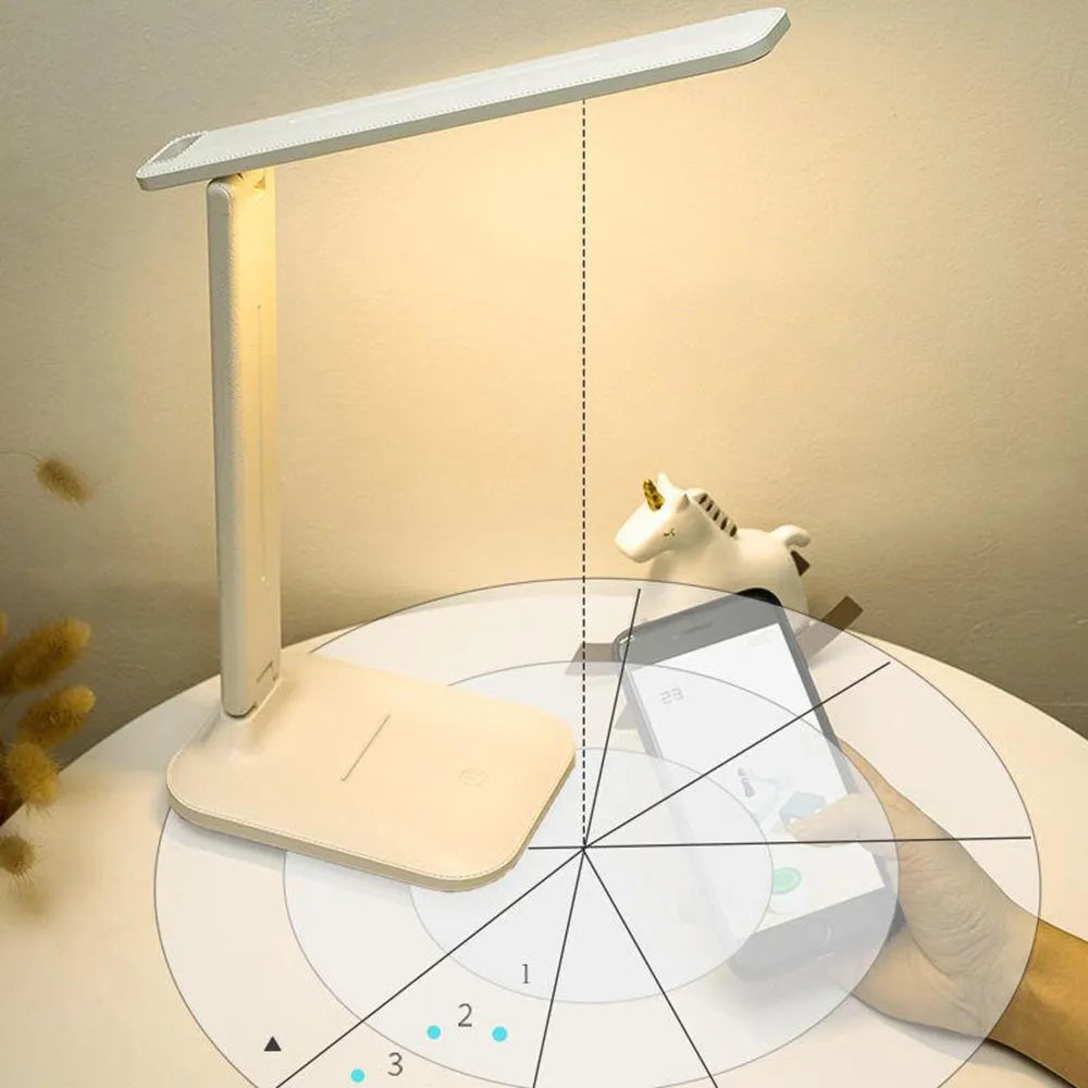 White plastic LED table lamp with touch dimming controls for bedside use